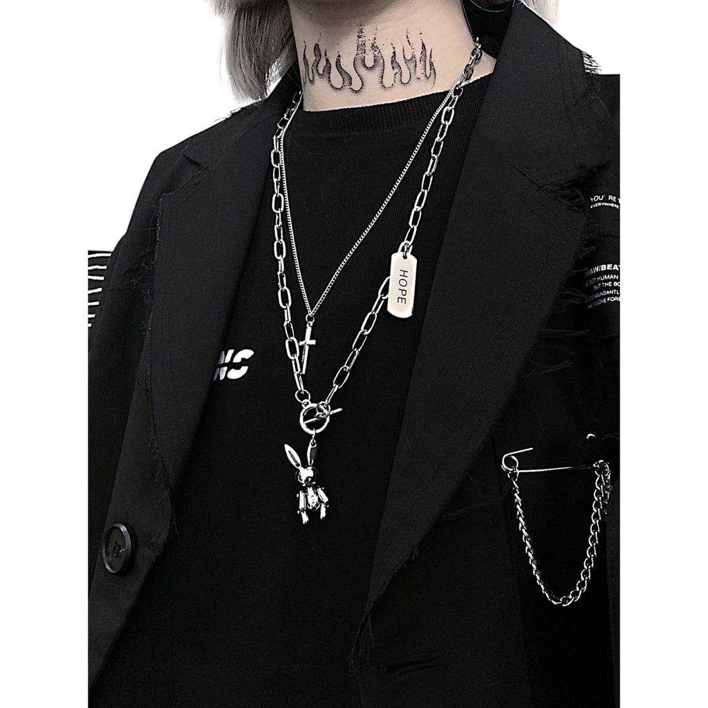 Layered silver gothic necklace with bunny pendant, cross charm, and HOPE tag in stainless steel, streetwear fashion accessory