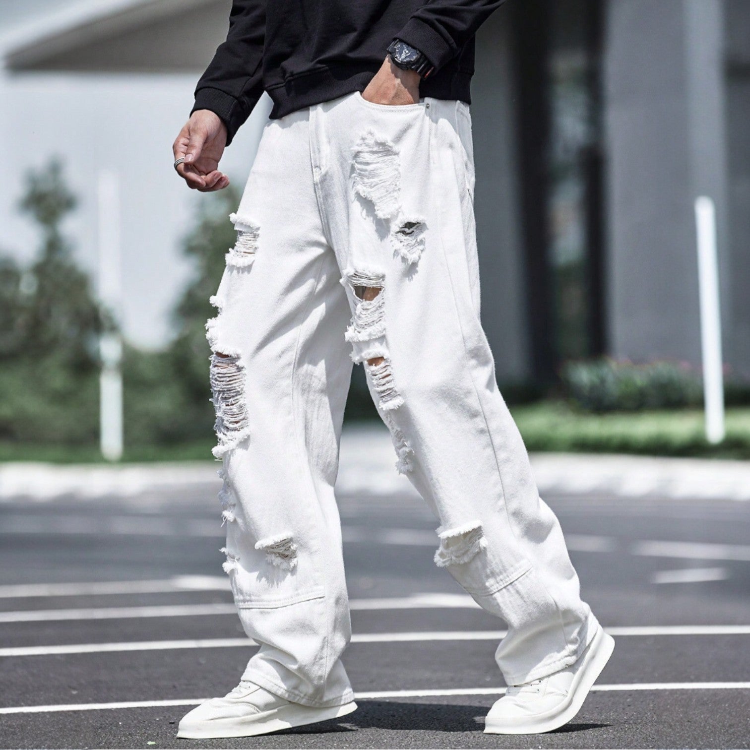 Men’s white ripped wide-leg jeans with heavy distressing and streetwear fit