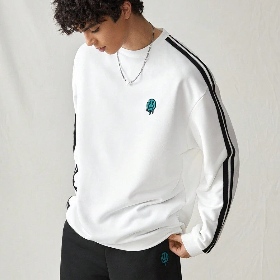 Japanese streetwear white pullover sweatshirt with black side stripes, loose fit, and embroidered chest detail