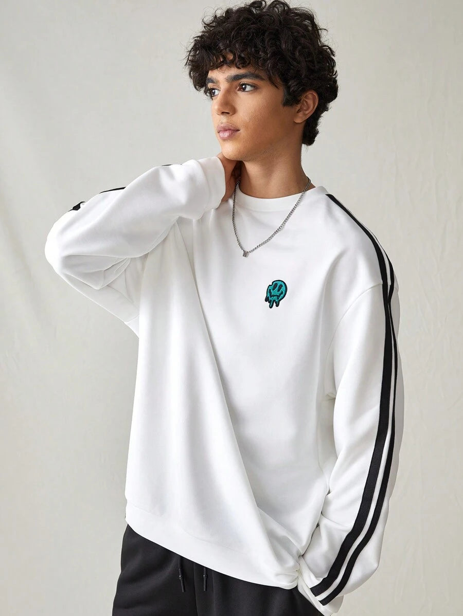 Japanese streetwear white pullover sweatshirt with black side stripes, loose fit, and embroidered chest detail