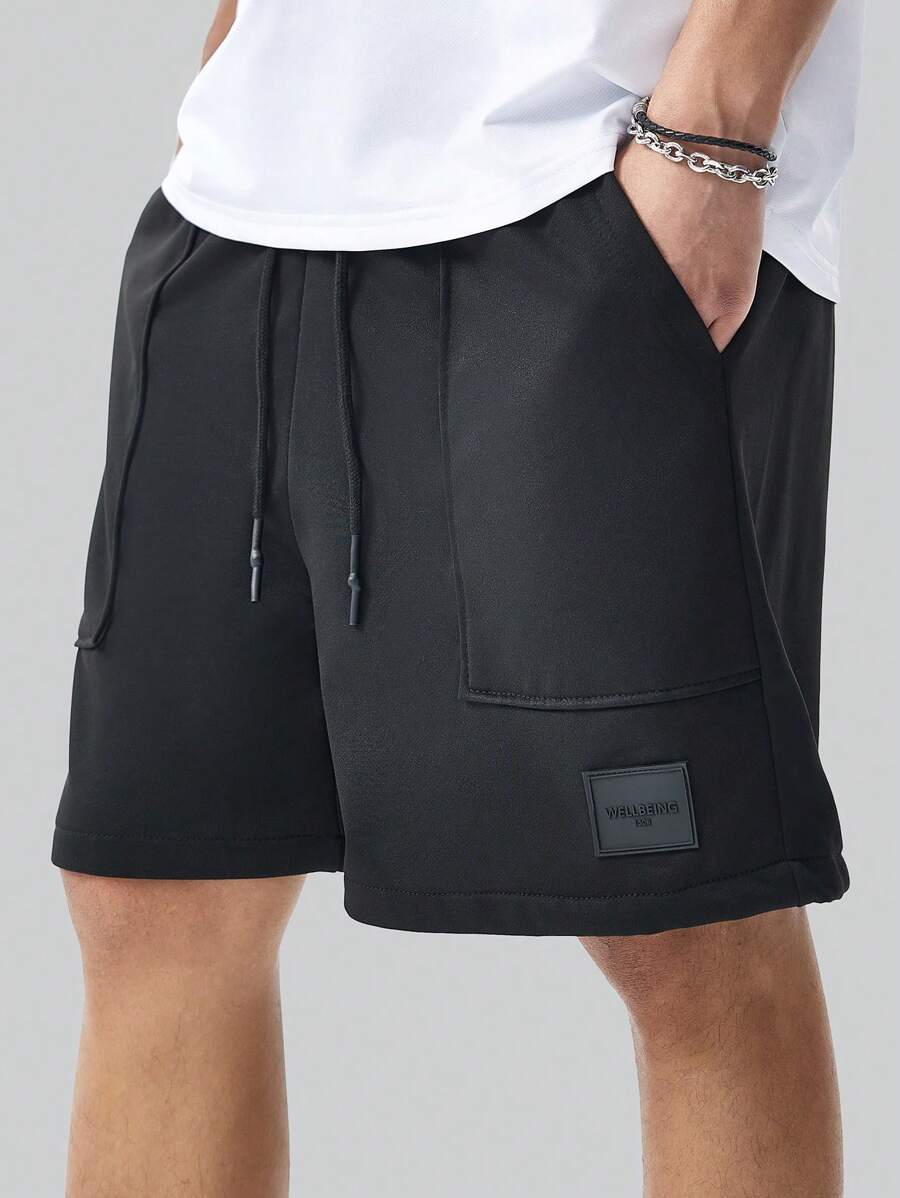 Men’s black and black colorblock drawstring shorts with patch pockets and letter detail