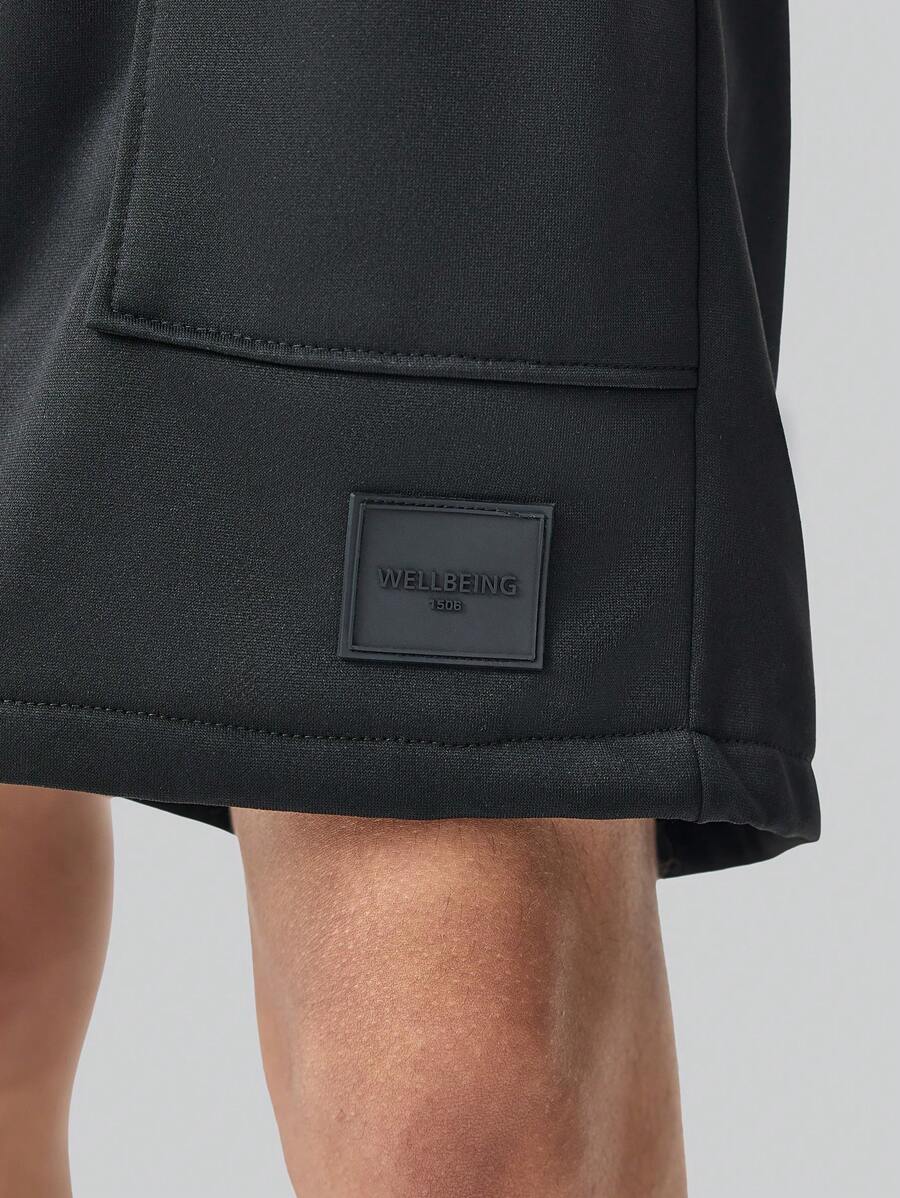 Men’s black and black colorblock drawstring shorts with patch pockets and letter detail