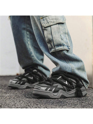 Chunky grey black sneakers with thick rope laces, futuristic streetwear platform shoes