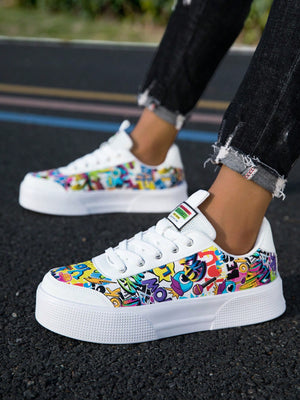 Colorful graffiti street sneakers with white base and comic-style print, lace-up low tops with EVA sole