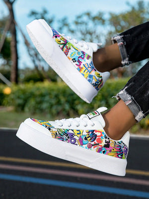 Colorful graffiti street sneakers with white base and comic-style print, lace-up low tops with EVA sole