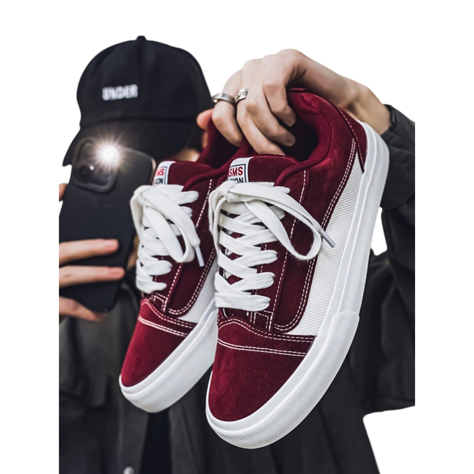 Burgundy and white low-top sneakers with lace-up closure, mesh upper, and flat rubber outsole, modern streetwear shoes