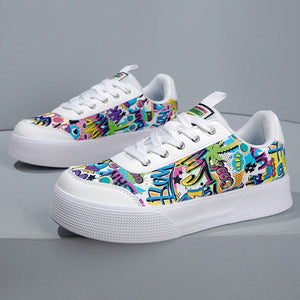 Colorful graffiti street sneakers with white base and comic-style print, lace-up low tops with EVA sole