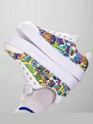 Colorful graffiti street sneakers with white base and comic-style print, lace-up low tops with EVA sole