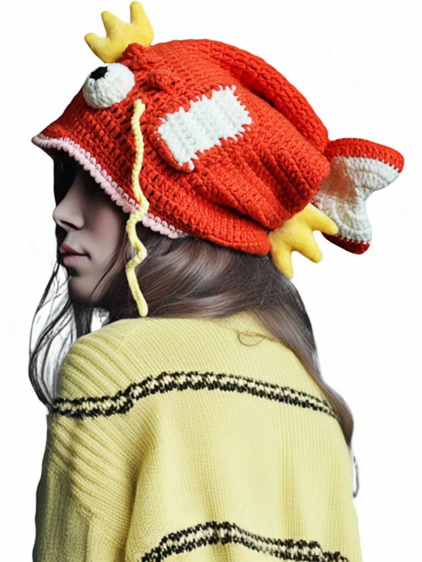Orange crocheted fish hat with large fins, cartoon eyes, and crown, Magikarp-inspired kawaii streetwear beanie for women