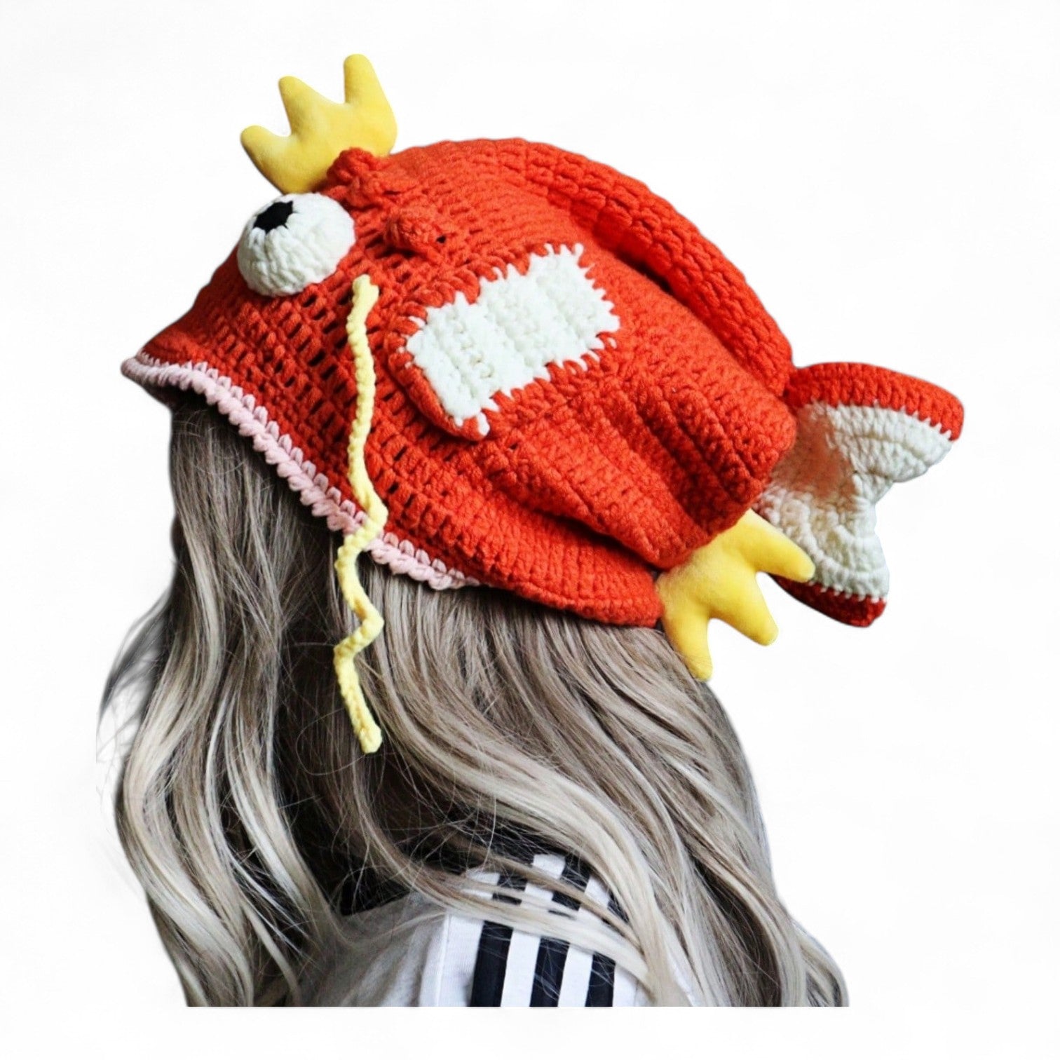 Orange crocheted fish hat with large fins, cartoon eyes, and crown, Magikarp-inspired kawaii streetwear beanie for women