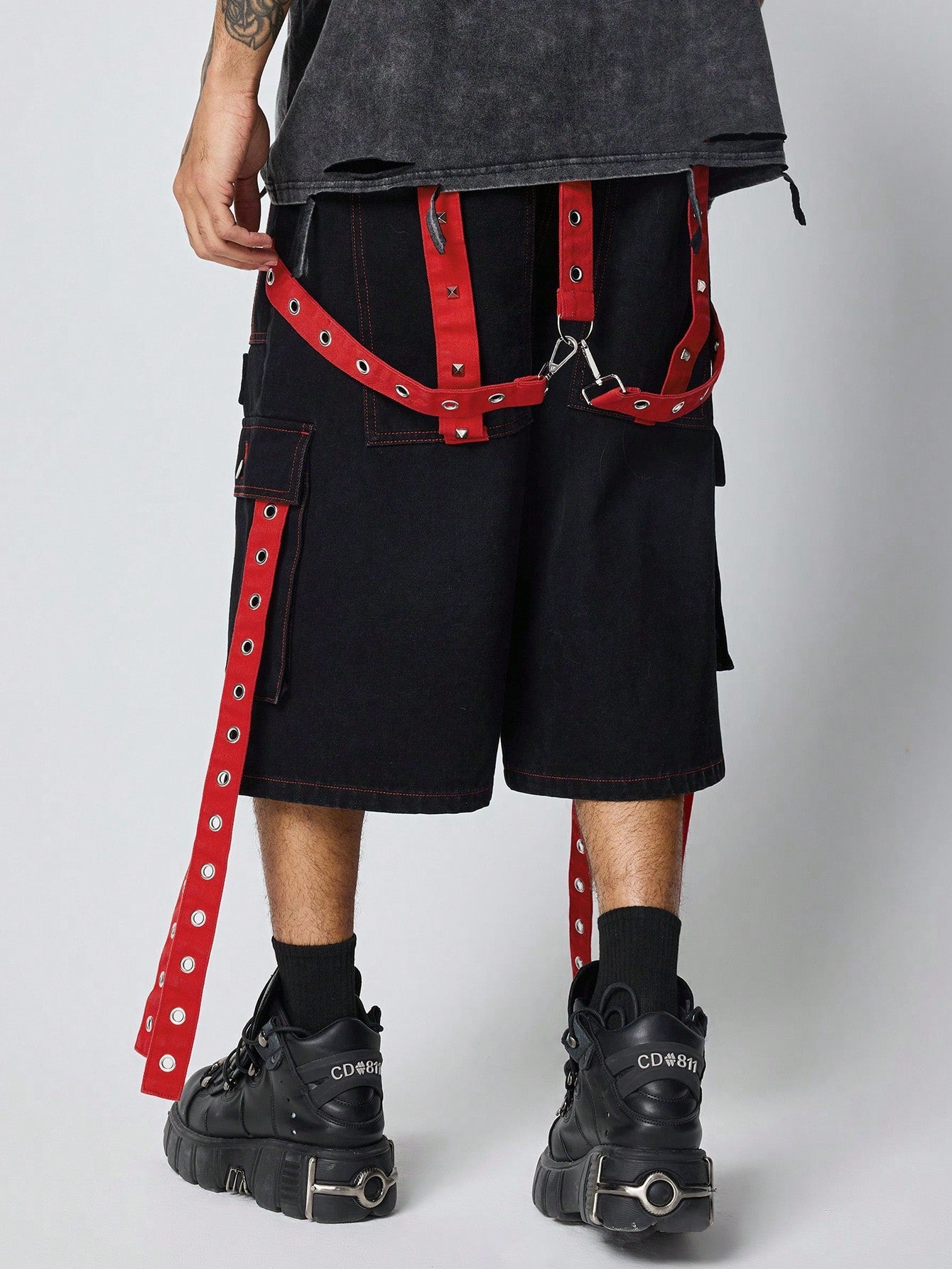 Black and red denim Bermuda shorts with straps, zippers, and pocket details – Japanese streetwear style