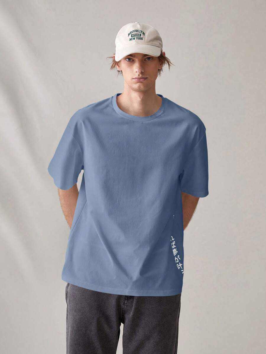 Tokyo oversized streetwear T-shirt with Japanese graphic print, slogan, and loose drop-shoulder fit