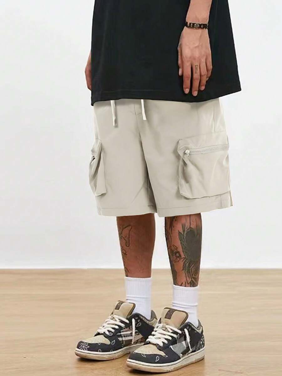 Men’s black hip-hop cargo shorts with drawstring waist and oversized zippered pockets – loose streetwear style