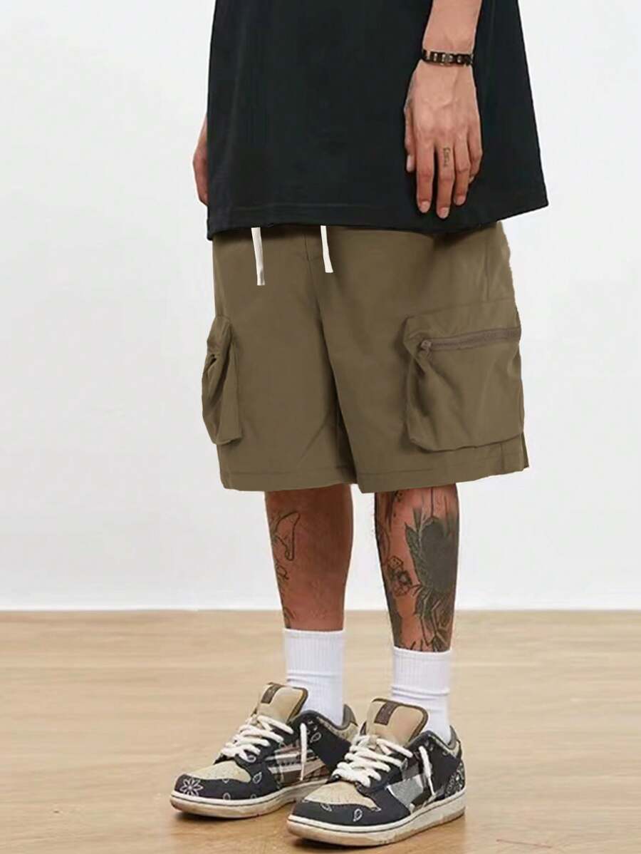 Men’s black hip-hop cargo shorts with drawstring waist and oversized zippered pockets – loose streetwear style