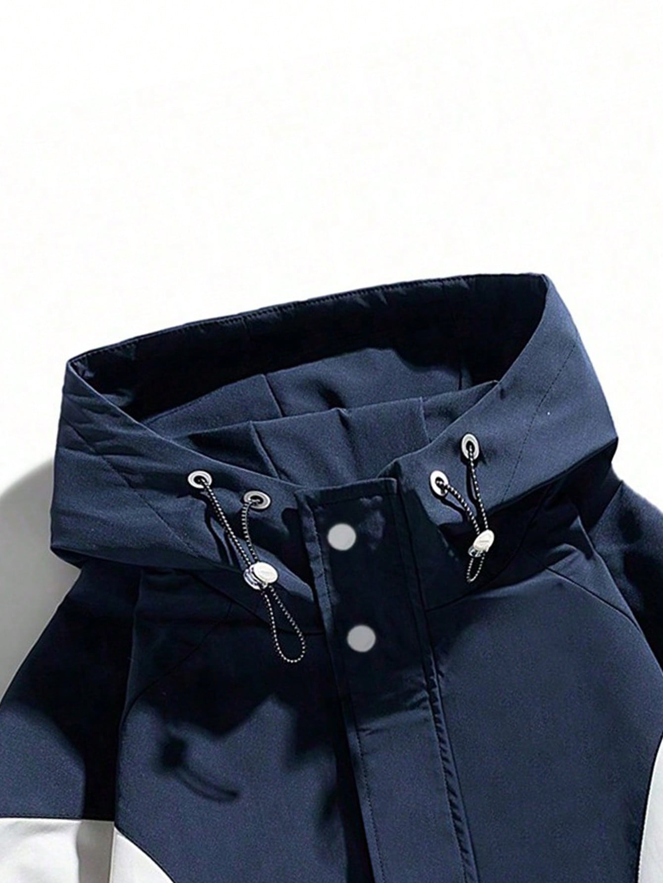 Japanese streetwear hooded windbreaker jacket in blue and white colorblock with zipper and drawstring