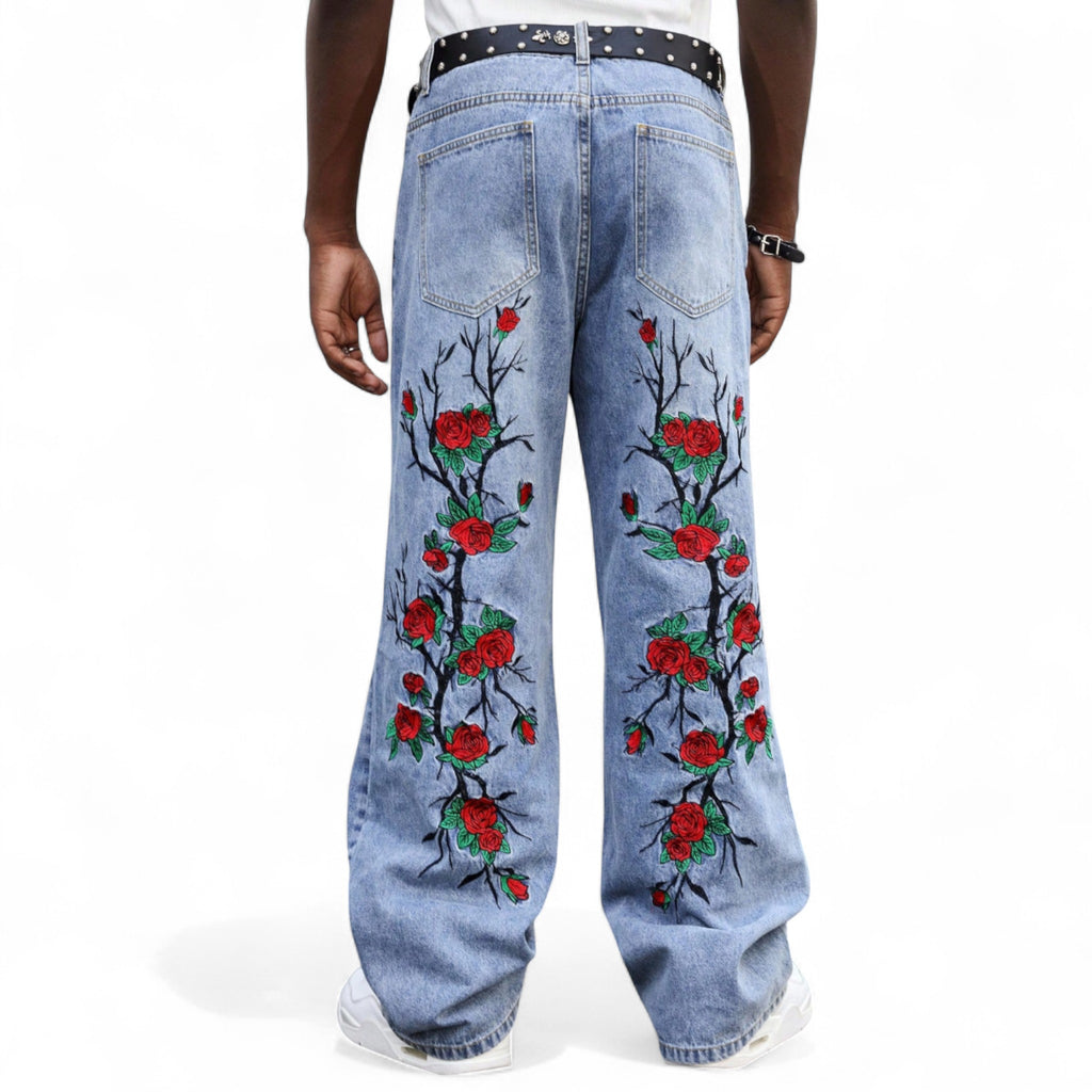 Japanese streetwear embroidered rose jeans in blue denim with gothic floral design and wide-leg fit