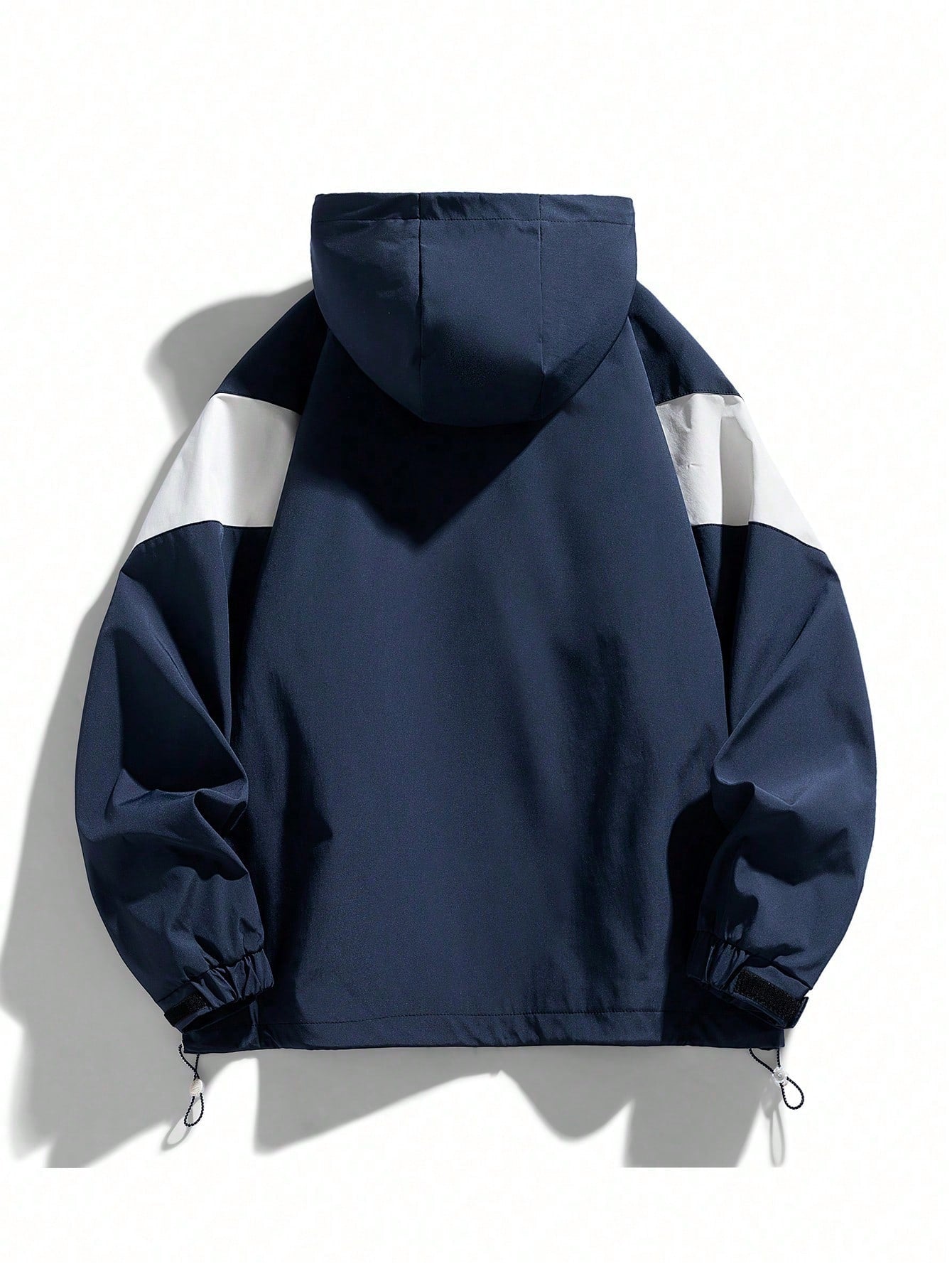 Japanese streetwear hooded windbreaker jacket in blue and white colorblock with zipper and drawstring
